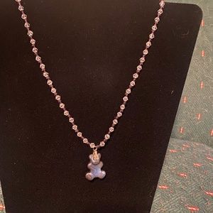 Clear and purple crystals with a hematite, teddy bear, pendant